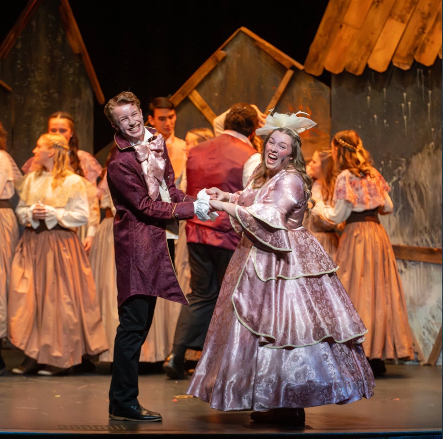 Scrooge sharing a moment with the cast