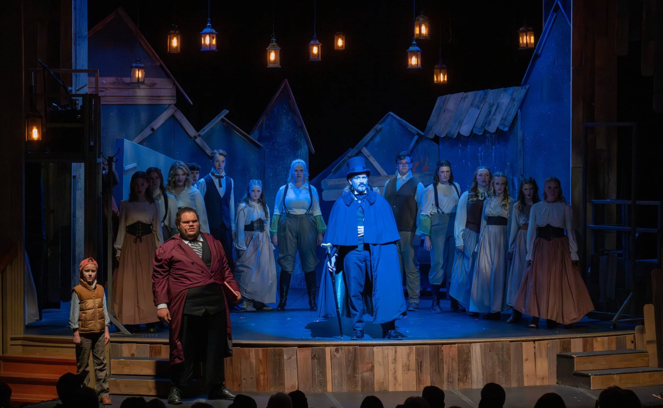 The full company on stage
